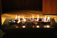 Un grupo de personas de pie frente a una chimenea en Le Metropolitan, Paris Tour Eiffel, a Tribute Portfolio Hotel, en París