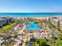an aerial view of a resort with a pool and the beach at Hotel Riu Palace Tikida Agadir - All Inclusive in Agadir