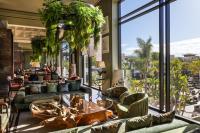 a lobby with couches and a large window at Hotel Riu Palace Tikida Agadir - All Inclusive in Agadir