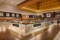 a large kitchen with a bunch of food on display at Hotel Riu Palace Tikida Agadir - All Inclusive in Agadir