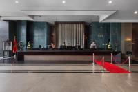a lobby with a red carpet in front of a desk at Hotel Riu Palace Tikida Agadir - All Inclusive in Agadir