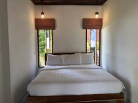 Postel nebo postele na pokoji v ubytování Itsara bungalow