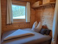 Posteľ alebo postele v izbe v ubytovaní Gemütliches Ferienhaus mit Holzofen und Sauna