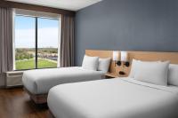 a hotel room with two beds and a window at Hyatt Place Atlanta Airport North in Atlanta