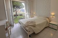 Posteľ alebo postele v izbe v ubytovaní Residenza Pierre & Vacances Luni Mare