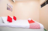 OYO 1224 Hotel Hajah Rohayahにあるベッド