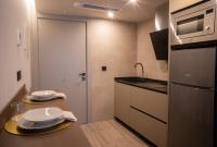 Kuchyň nebo kuchyňský kout v ubytování Almazara Suites