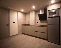 Kuchyň nebo kuchyňský kout v ubytování Almazara Suites