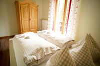 Posteľ alebo postele v izbe v ubytovaní Gstattlhof Mountain Farmhouse