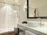 a white bathroom with a sink and a shower at Only YOU Boutique Hotel Madrid in Madrid