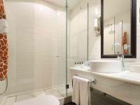 a bathroom with a sink and a glass shower at Only YOU Boutique Hotel Madrid in Madrid