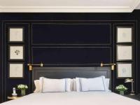 a bedroom with a large bed with a black headboard at Only YOU Boutique Hotel Madrid in Madrid