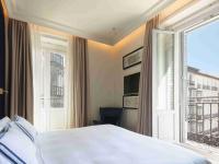 a bedroom with a bed and a large window at Only YOU Boutique Hotel Madrid in Madrid