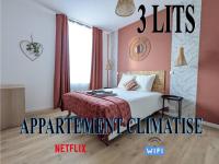 Łóżko lub łóżka w pokoju w obiekcie Gite La Clematite