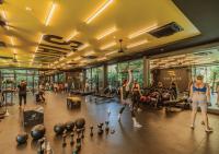a group of people exercising in a gym at Stay Wellbeing & Lifestyle Resort in Rawai Beach