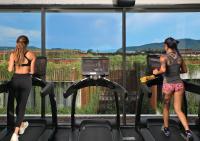 a group of women on treadmills in a gym at Stay Wellbeing & Lifestyle Resort in Rawai Beach