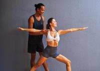 a man and a woman standing in a dance pose at Stay Wellbeing & Lifestyle Resort in Rawai Beach