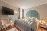 Łóżko lub łóżka w pokoju w obiekcie Lotus Therme Hotel & Spa