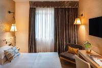 Posteľ alebo postele v izbe v ubytovaní Starhotels Metropole