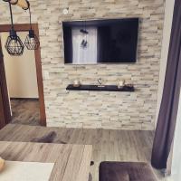 Telewizja i/lub zestaw kina domowego w obiekcie Bora Appartements 1 mit 4 Schlafzimmer