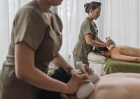 a woman getting a massage from another woman at Stay Wellbeing & Lifestyle Resort in Rawai Beach