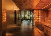 a hallway of a building with glass doors at Stay Wellbeing & Lifestyle Resort in Rawai Beach