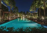 a pool at the resort at night at Stay Wellbeing & Lifestyle Resort in Rawai Beach