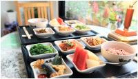 a tray filled with different types of food on a table at Errantry Lodge &amp; Studio in Hualien City