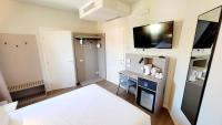 A bed or beds in a room at Hotel Aurora Duino