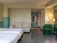 Postel nebo postele na pokoji v ubytování Ibis Styles Zaragoza Ramiro I