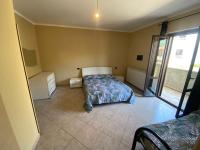 A bed or beds in a room at Il Melograno
