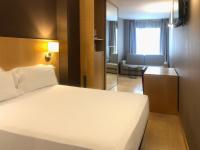 Posteľ alebo postele v izbe v ubytovaní Hotel Sercotel Portales