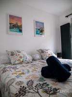 Posteľ alebo postele v izbe v ubytovaní L'appartement de jeanne