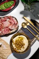 Una mesa con dos platos de comida y un tazón de comida. en Hotel Petit Bois - Adults from 14, en Balatonfüred