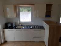 Kuchyňa alebo kuchynka v ubytovaní Apartments Villa Maslinica