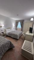 Łóżko lub łóżka w pokoju w obiekcie Hotel Terranova