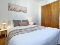 A bed or beds in a room at A Levante Conil- Solo familias y parejas