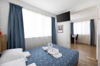 Ein Bett oder Betten in einem Zimmer der Unterkunft Villa Okruk-10 meters away from the beach
