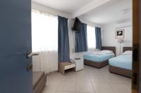 Ein Bett oder Betten in einem Zimmer der Unterkunft Villa Okruk-10 meters away from the beach