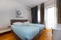 Ein Bett oder Betten in einem Zimmer der Unterkunft Villa Okruk-10 meters away from the beach