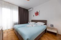 Ein Bett oder Betten in einem Zimmer der Unterkunft Villa Okruk-10 meters away from the beach