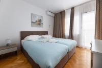 Ein Bett oder Betten in einem Zimmer der Unterkunft Villa Okruk-10 meters away from the beach