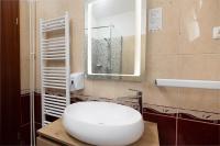 ein Badezimmer mit einer weißen Toilette und einem Spiegel in der Unterkunft Villa Okruk-10 meters away from the beach in Trogir