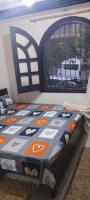 Postel nebo postele na pokoji v ubytování Enjoy modern cozy entire studio in a fancy building with Free Wi-Fi & AC and Flat screen TV in Loran in the heart of Alexandria