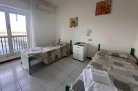Posteľ alebo postele v izbe v ubytovaní Residenza Pierre & Vacances Luni Mare