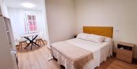 Posteľ alebo postele v izbe v ubytovaní Hostal Cachiño