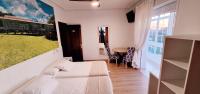 Posteľ alebo postele v izbe v ubytovaní Hostal Cachiño