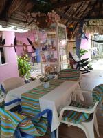 a room with a table and chairs in a room at Hotel Doña Edita in San Bernardo del Viento