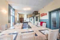 a large conference room with a long table and chairs at Parc Hôtel in Wangenbourg