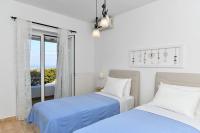 Posteľ alebo postele v izbe v ubytovaní DreamCatcher Sea view mini pool Paros